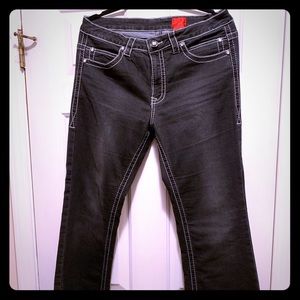 Black jeans with white stitching.